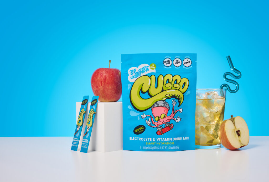Flavor-forward product photography featuring CUGGO, a crisp-apple hydration drink for kids. 
