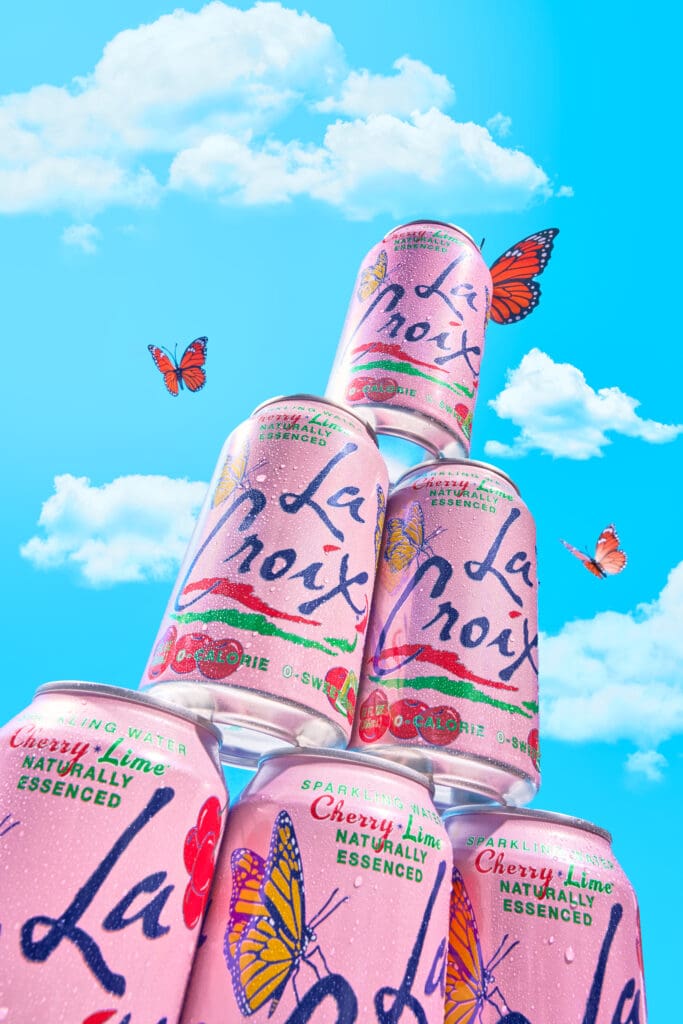 La Croix can shot, with clouds and butterflies.